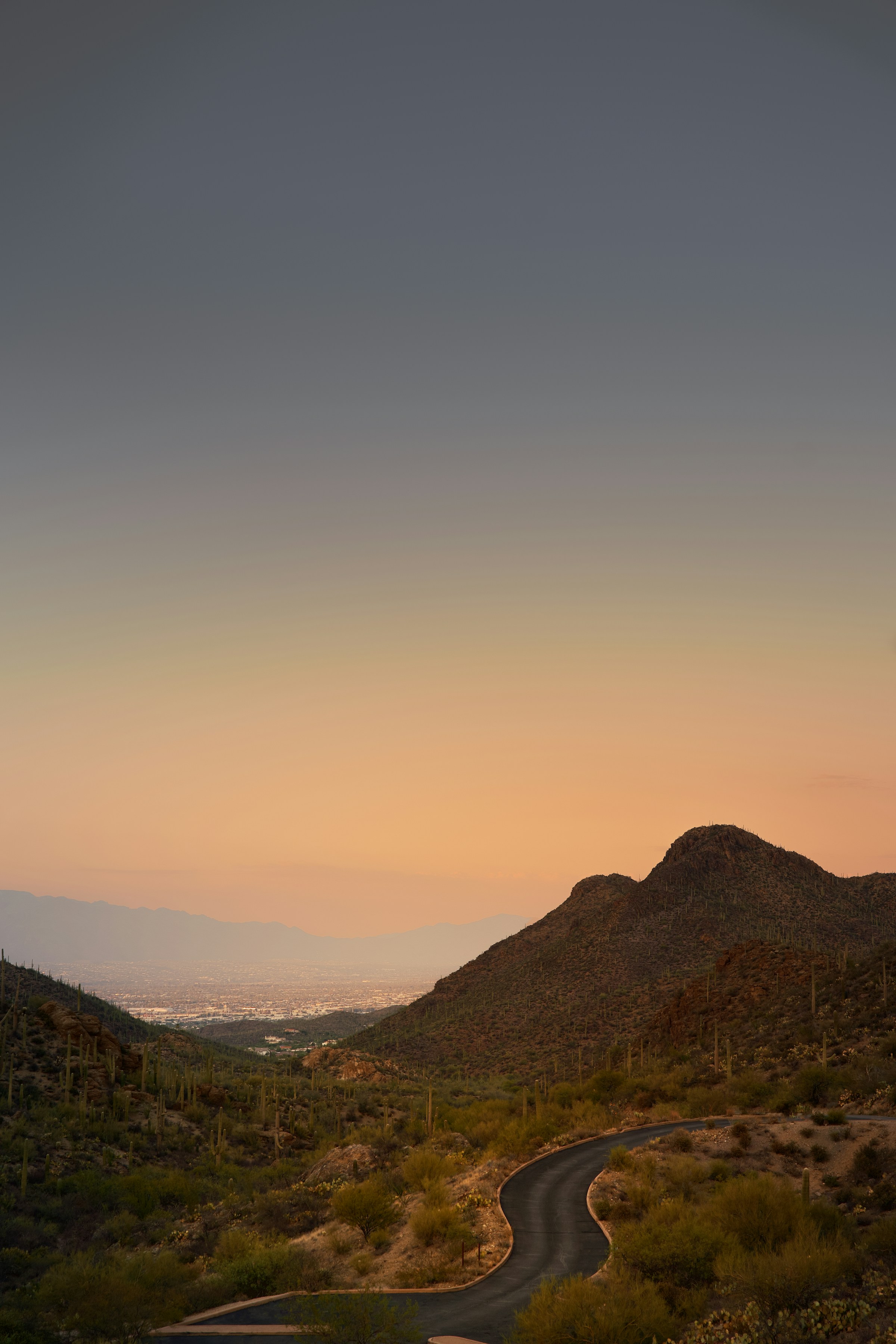 Desert road winding through mountains near Tucson